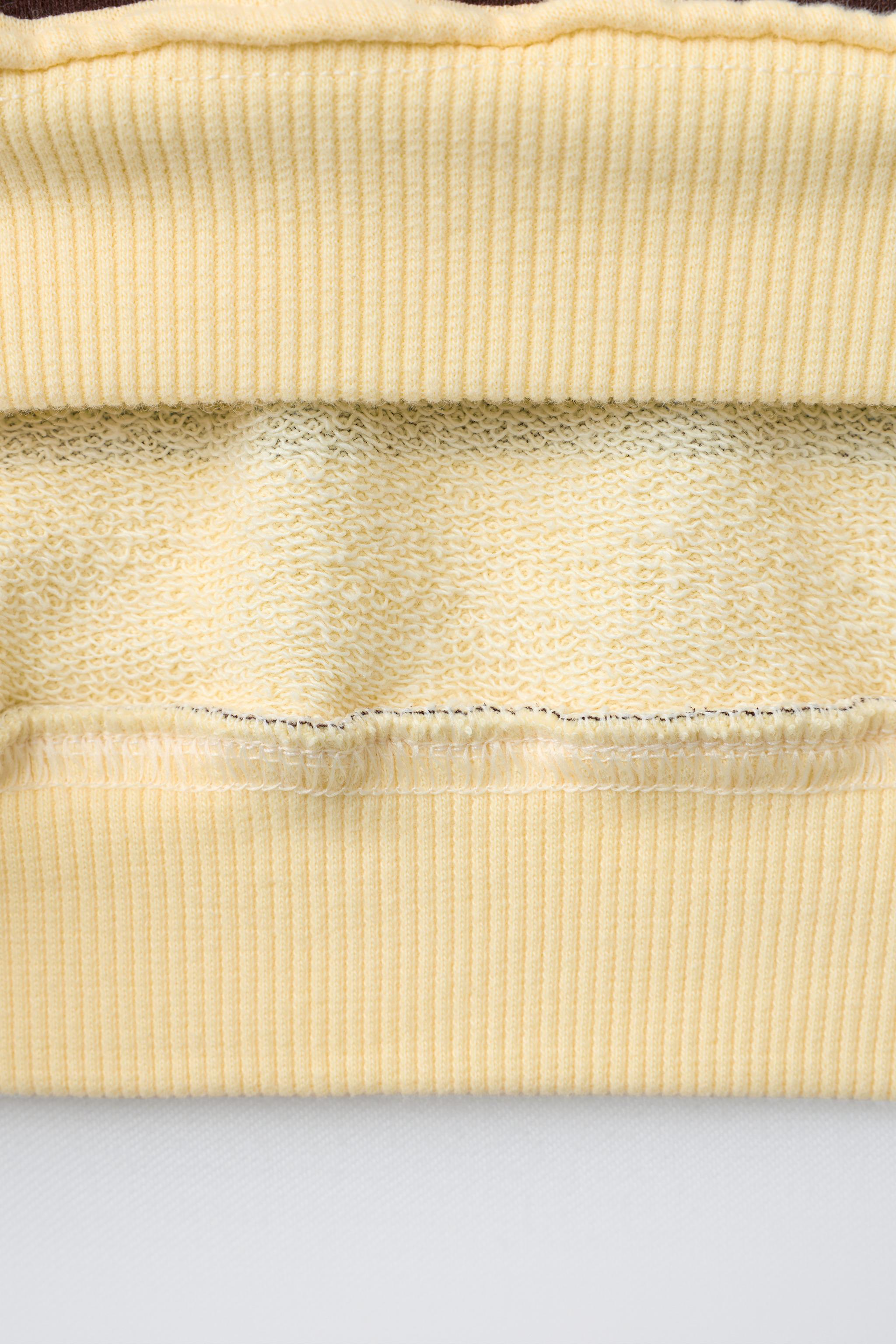 STRIPED PRINT SWEATSHIRT